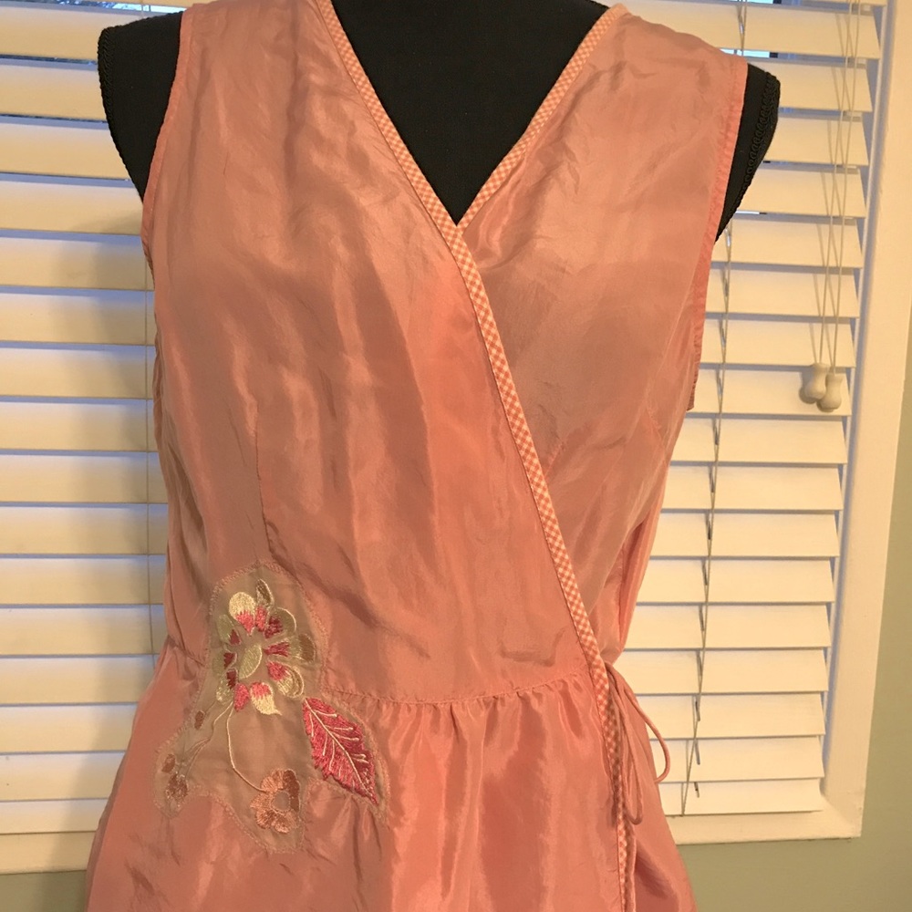 Blush colored sleeveless blouse from Anthropologie